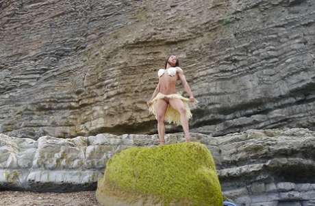 Bodybuilder babe Karyn showing off big tits and muscular body on beach 51120129
